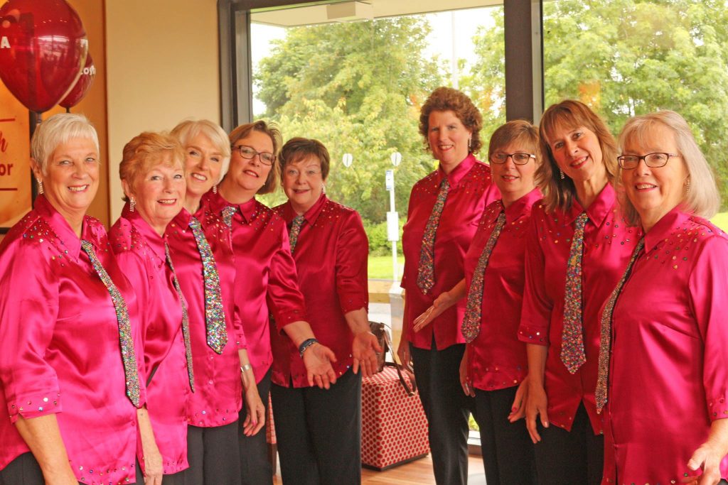 The group in raspberry pink shirts